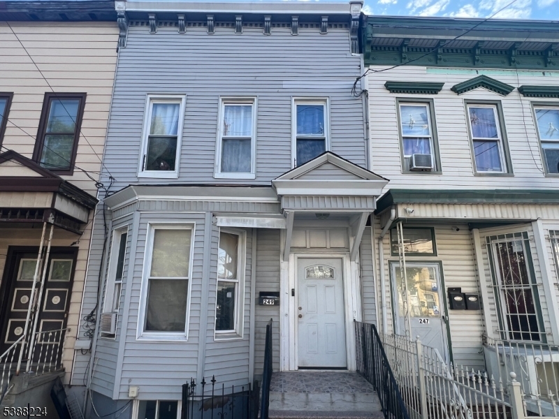 a front view of a house with glass windows