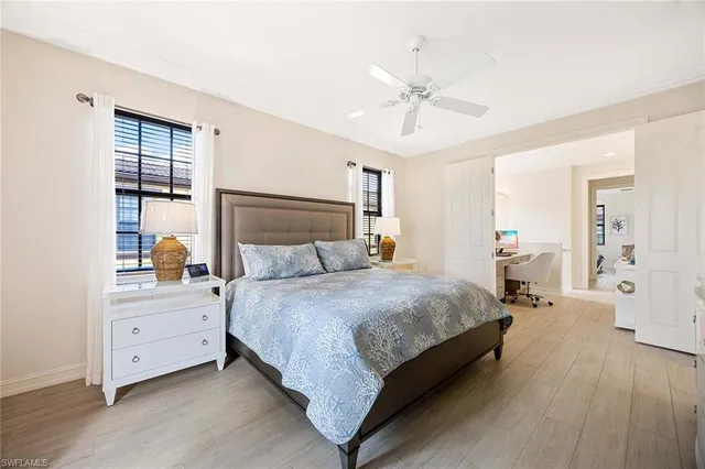 a bedroom with bed and window