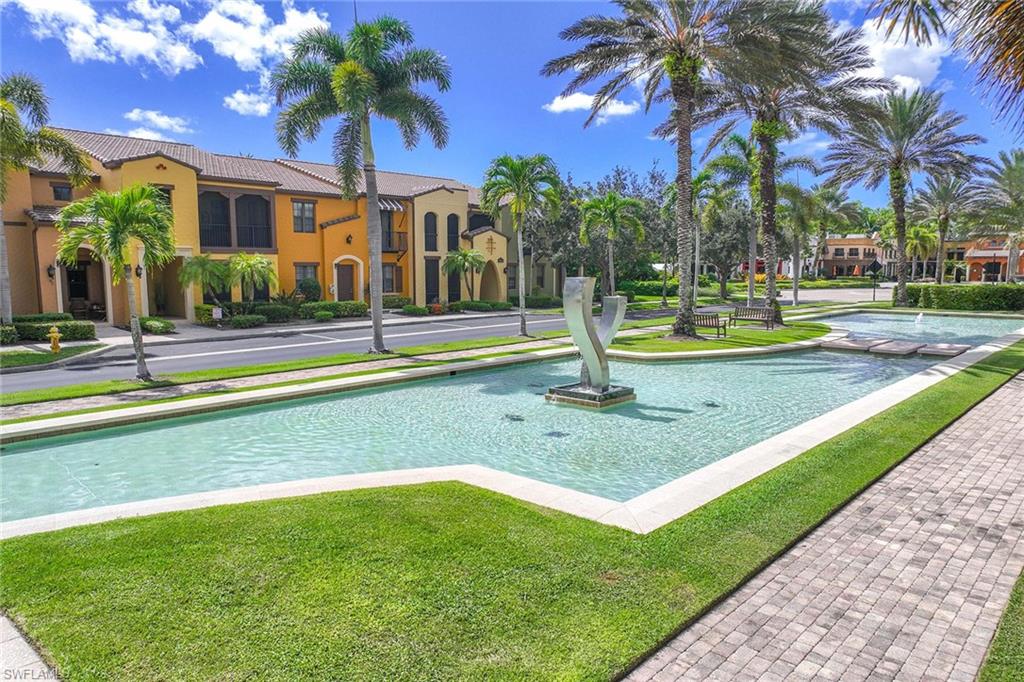 9076 Rialto Street, Unit 62 Naples, FL 34113 - Photo 6 of 50 a view of a house with swimming pool and a tree
