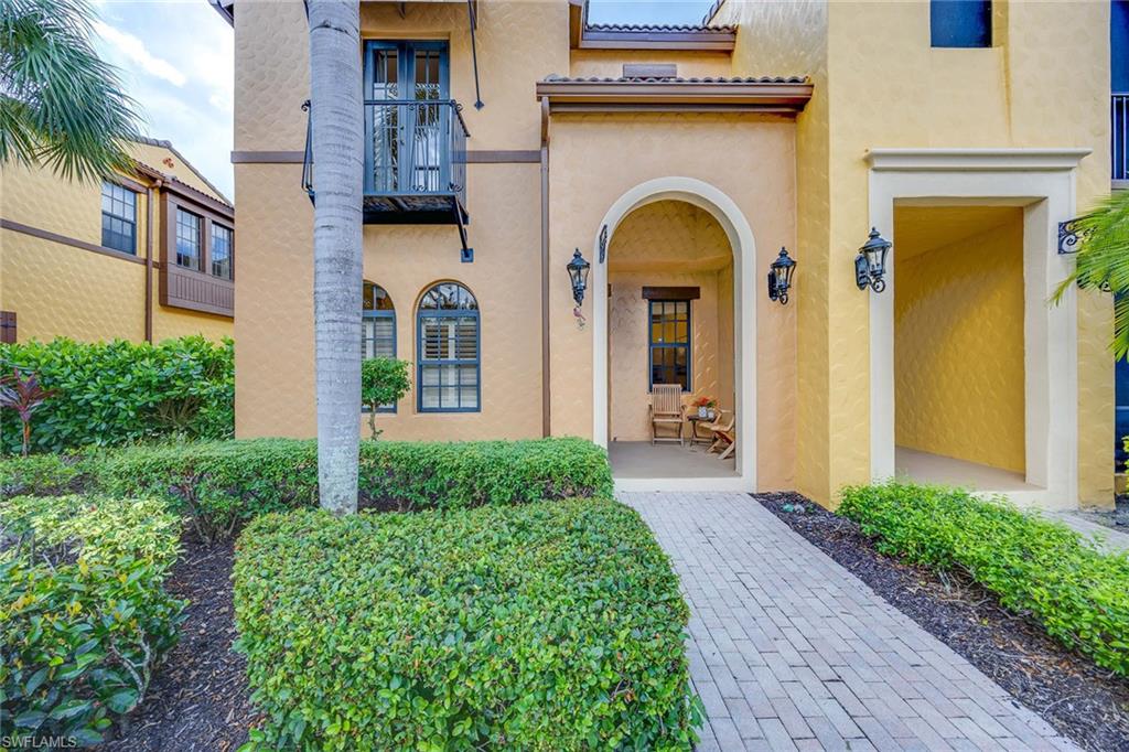 9076 Rialto Street, Unit 62 Naples, FL 34113 - Photo 7 of 50 a front view of a house with garden