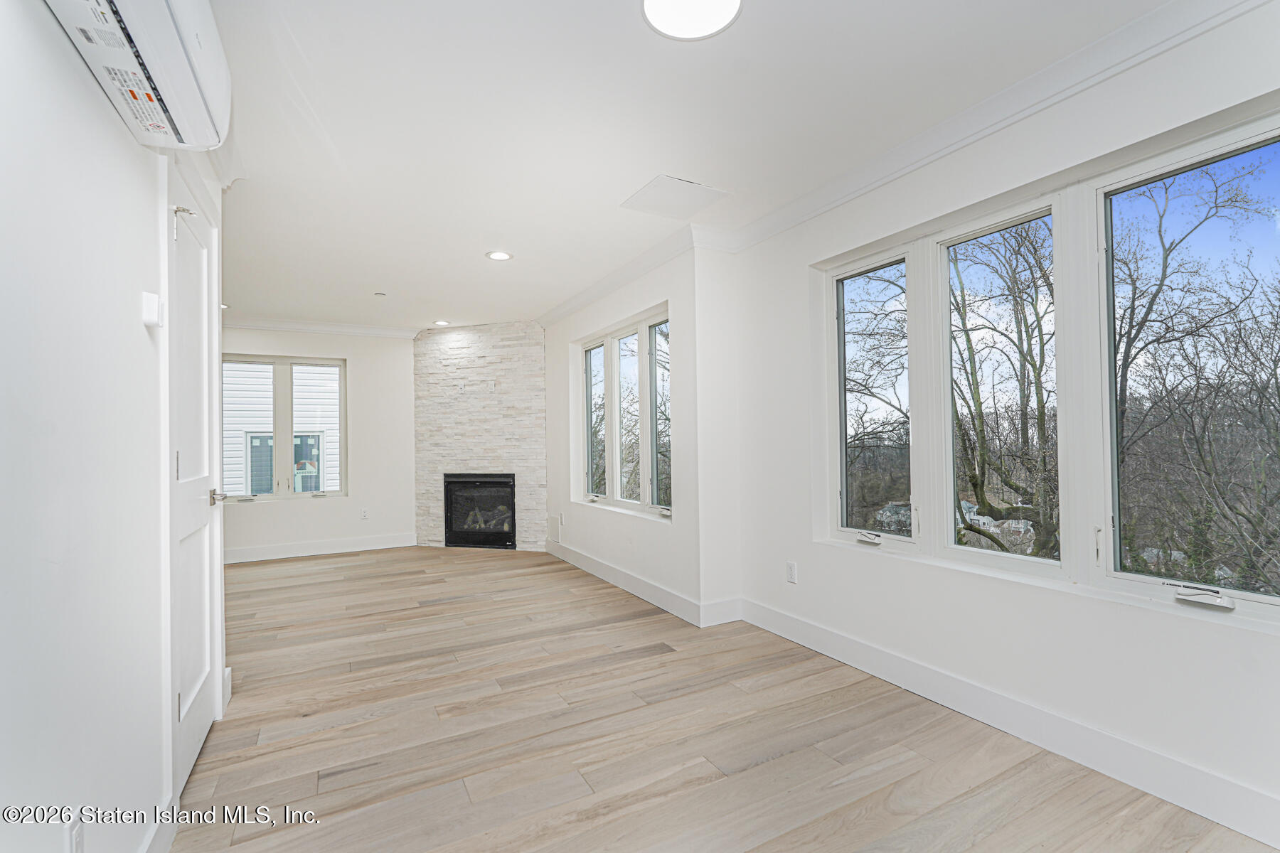 54 Cedarcliff Road Staten Island, NY 10301 - Photo 4 of 49 a view of a big room with windows and chandelier