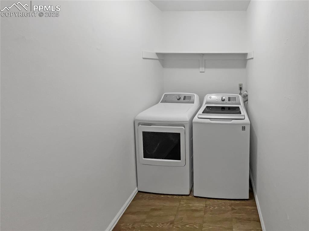 34 Rising Sun Terrace Colorado Springs, CO 80921 - Photo 11 of 20 a utility room with dryer and washer