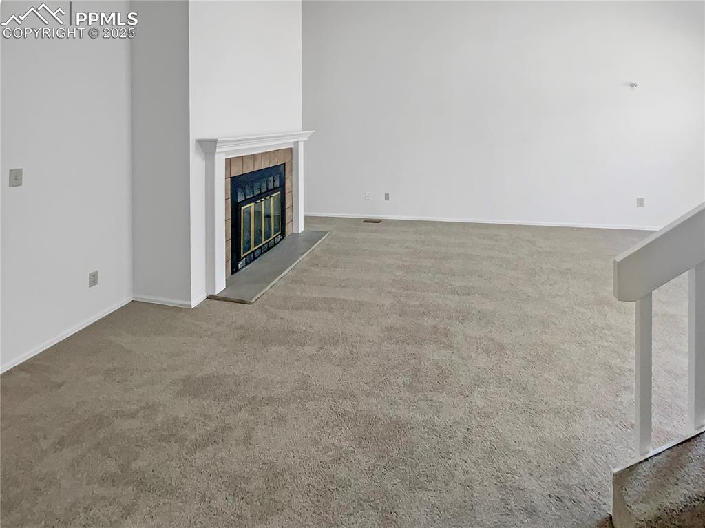 34 Rising Sun Terrace Colorado Springs, CO 80921 - Photo 12 of 20 a view of an empty room with a fireplace
