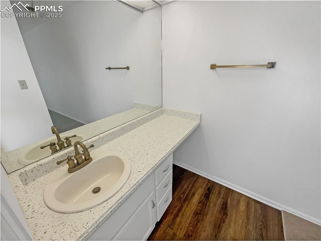 34 Rising Sun Terrace Colorado Springs, CO 80921 - Photo 17 of 20 a bathroom with a sink and a mirror