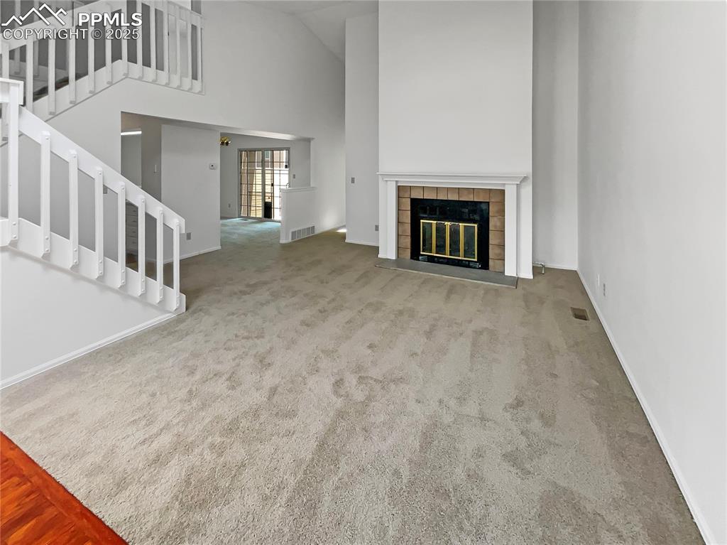 34 Rising Sun Terrace Colorado Springs, CO 80921 - Photo 3 of 20 a view of an empty room with fireplace and a window