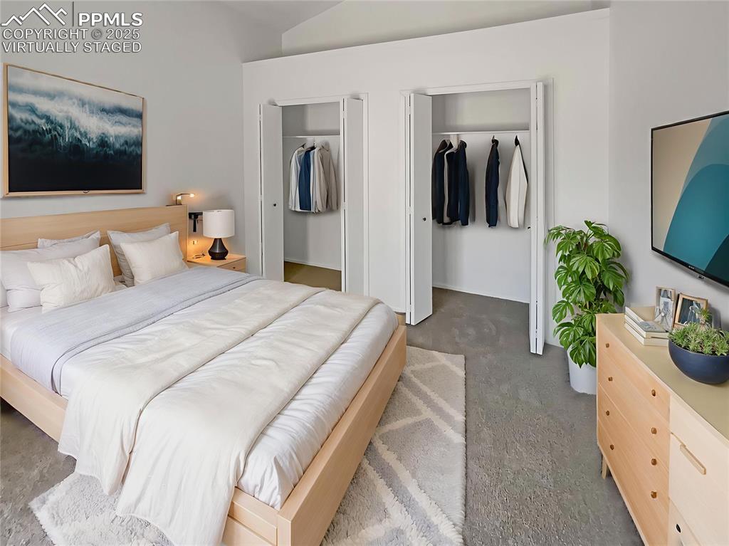 34 Rising Sun Terrace Colorado Springs, CO 80921 - Photo 4 of 20 a bedroom with a bed and a flat screen television