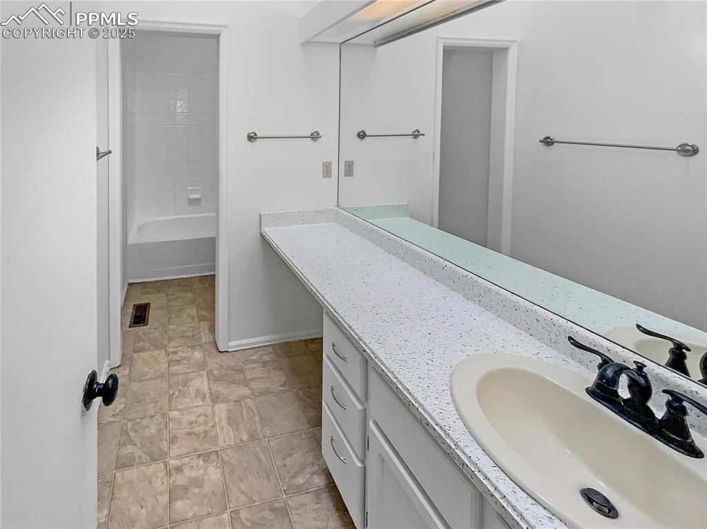 34 Rising Sun Terrace Colorado Springs, CO 80921 - Photo 7 of 20 a bathroom with a sink and a mirror