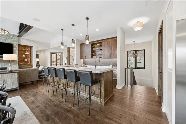 a large kitchen with a table and chairs