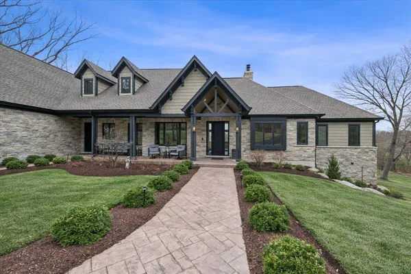 a front view of a house with garden