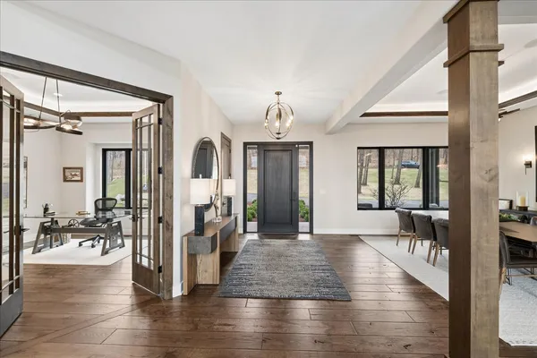a view of living room with furniture and wooden floor