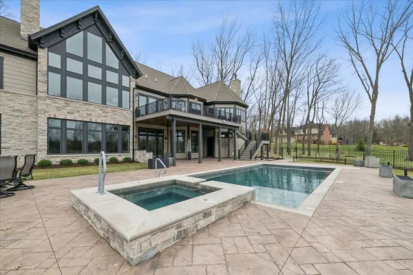 a view of swimming pool with a patio