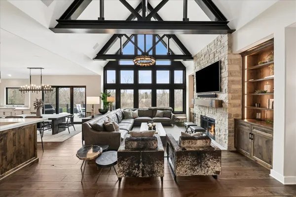a living room with furniture a rug and a flat screen tv