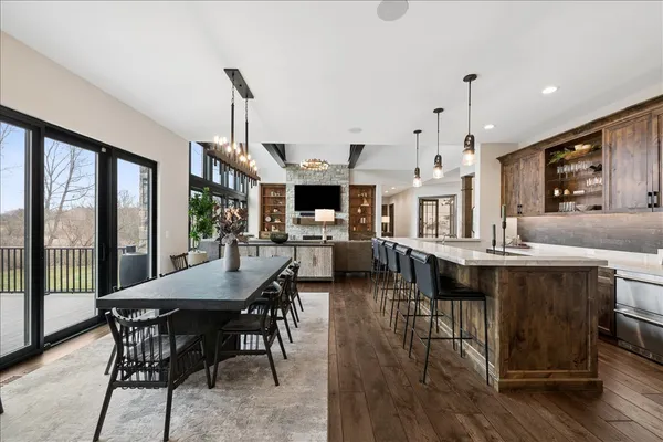 a view of a dining room with furniture window and wooden floor