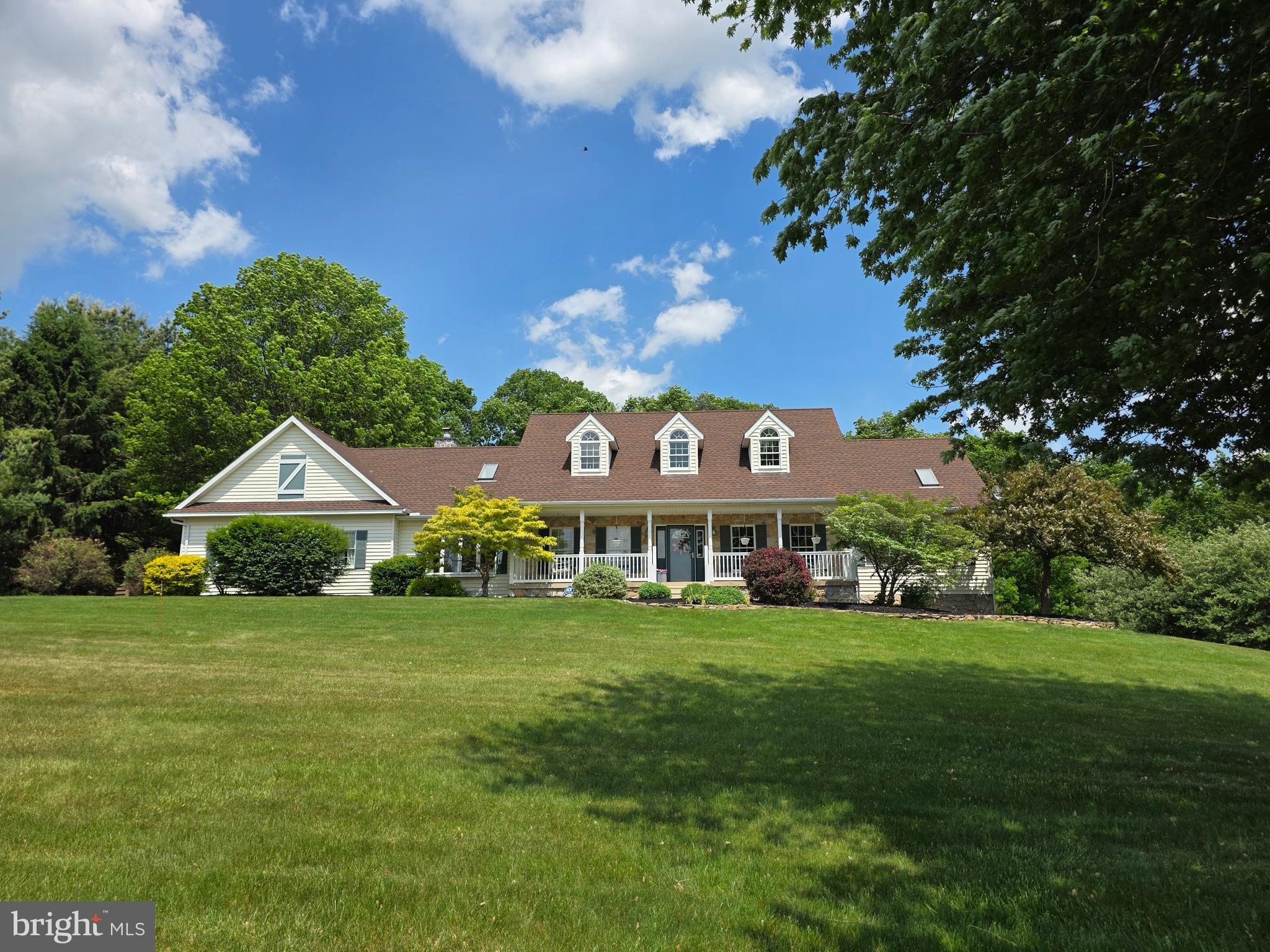 509 Buchland Road Narvon, PA 17555 - Photo 8 of 94 a front view of a house with a garden