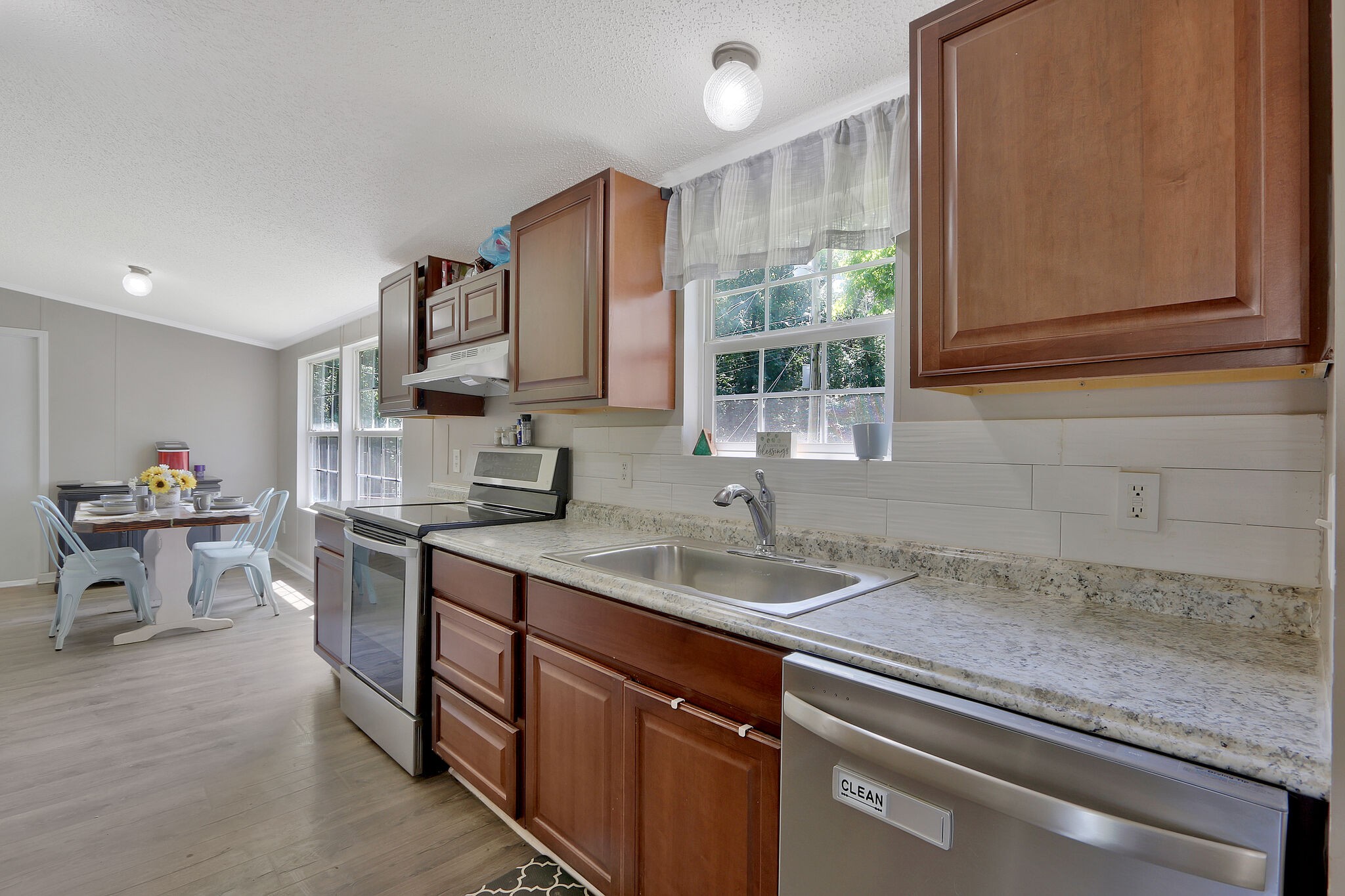 2218 Lee Road Spring Hill, TN 37174 - Photo 7 of 19 a kitchen with a sink stove and cabinets