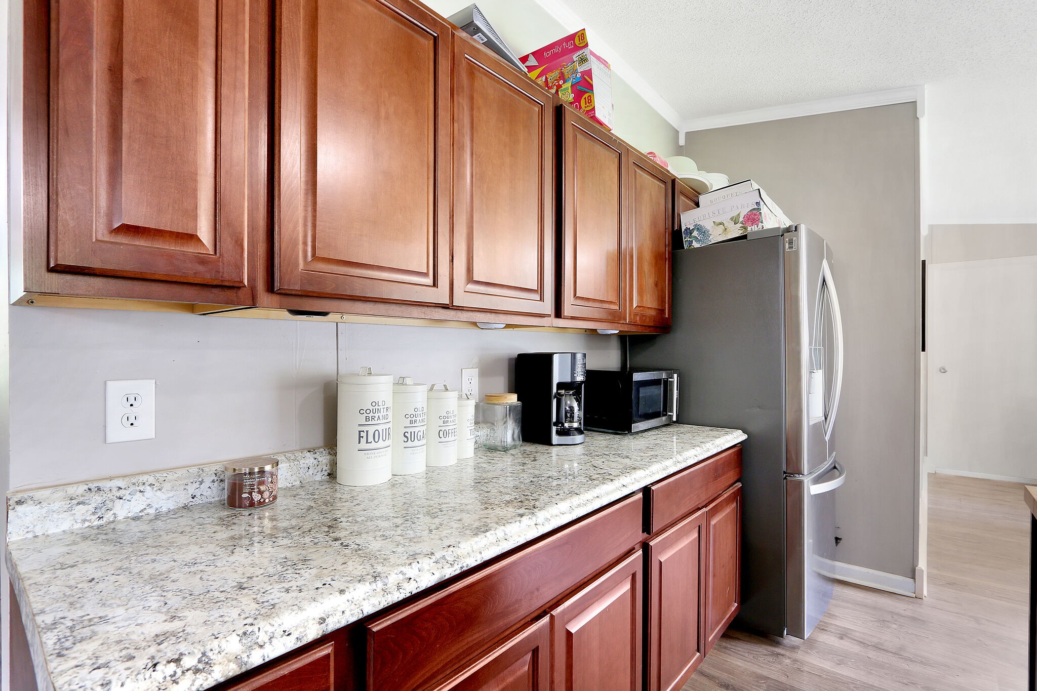2218 Lee Road Spring Hill, TN 37174 - Photo 8 of 19 a kitchen with stainless steel appliances granite countertop a sink refrigerator and cabinets