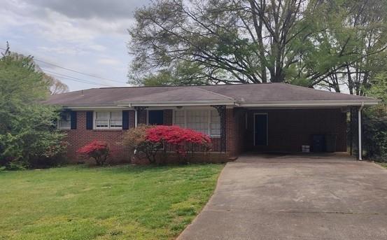 1511 Virginia Place Austell, GA 30168 - Photo 1 of 1 a front view of a house with a garden and yard