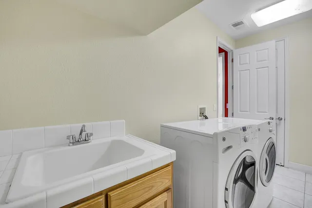 a living room with furniture a rug and a wooden floor