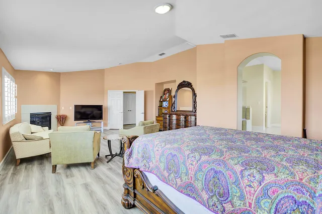 a view of wooden floor and windows in a room