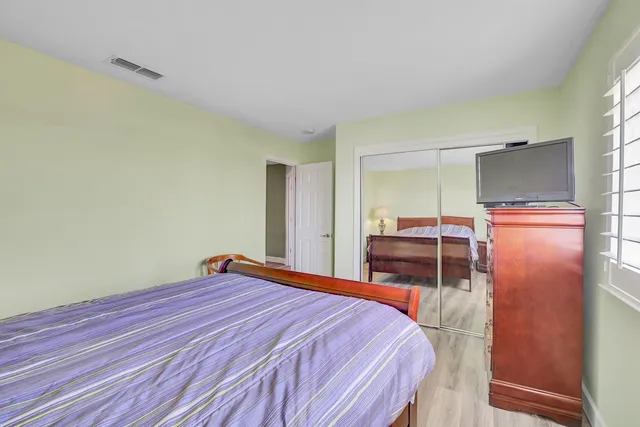 an aerial view of a house with large trees