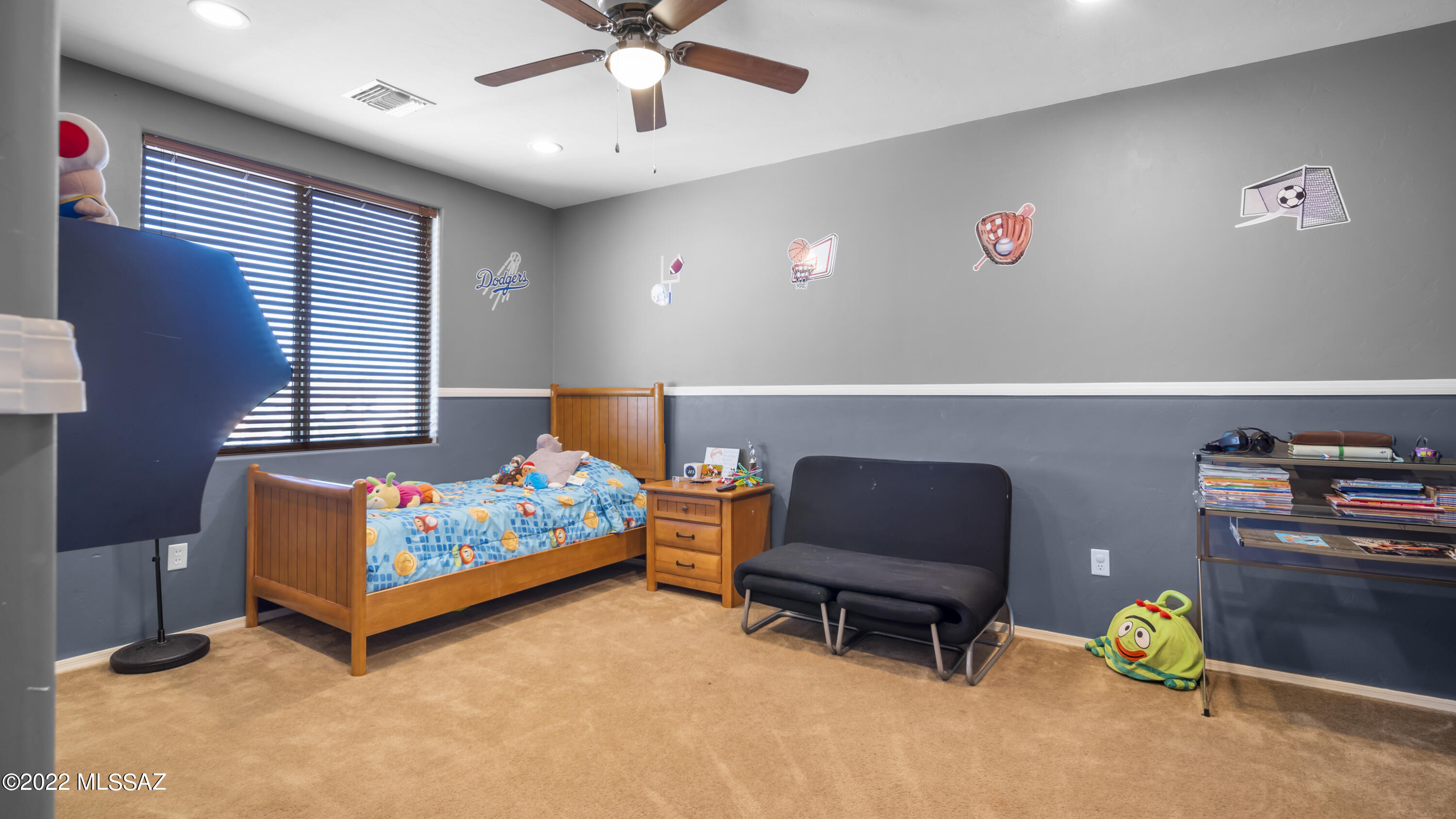 1081 Vista De Los Alamos Rio Rico, AZ 85648 - Photo 29 of 45 a bedroom with a bed and a couch