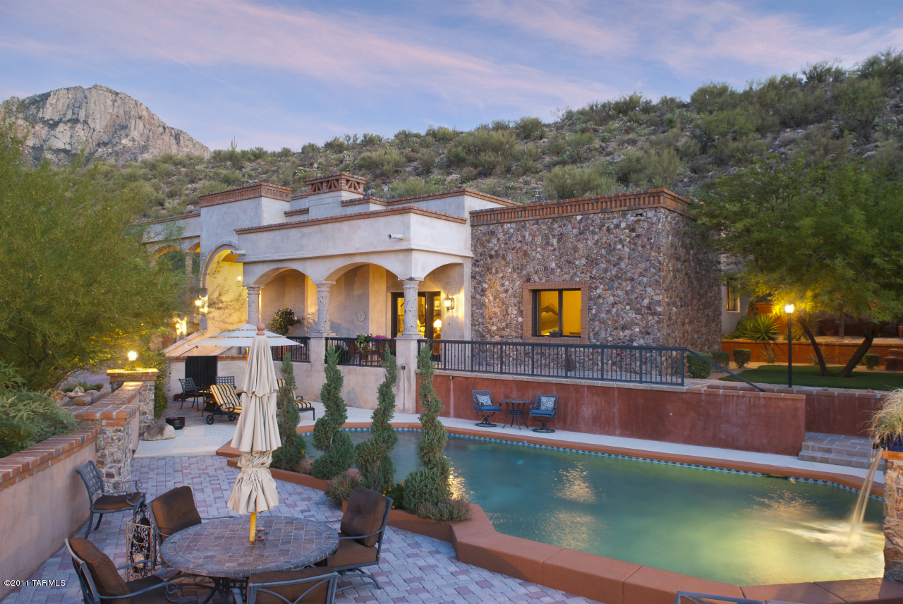 2188 East Buck Ridge Place Oro Valley, AZ 85737 - Photo 3 of 22 a view of a swimming pool with a patio and a yard