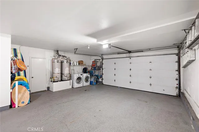 an aerial view of residential houses with city view