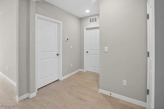 a view of an empty room with a window