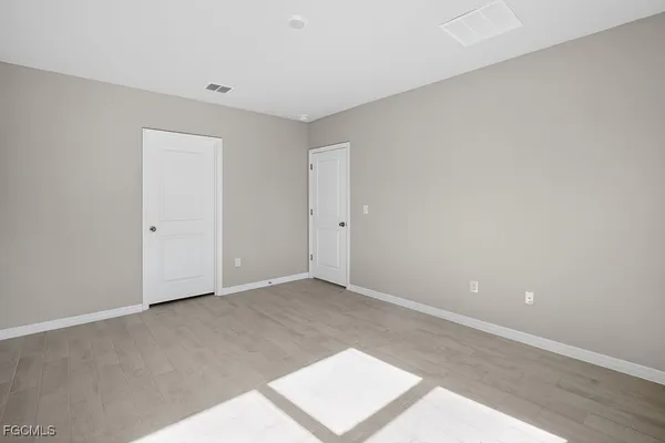 a bathroom with a double vanity sink and mirror