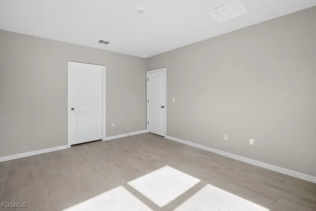 a bathroom with a double vanity sink and mirror