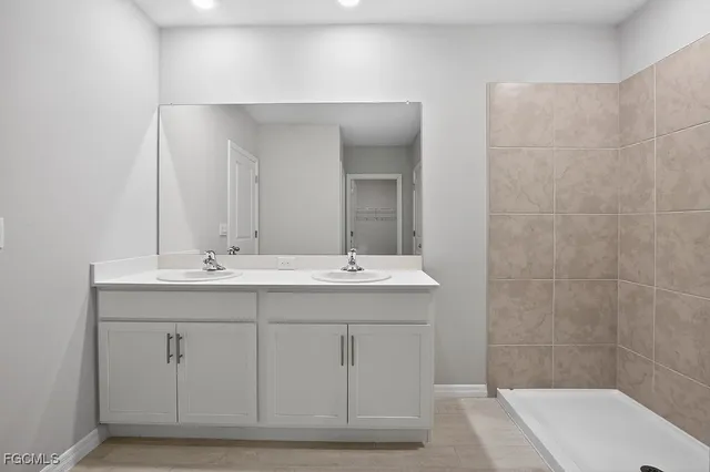 a white toilet sitting next to a white sink