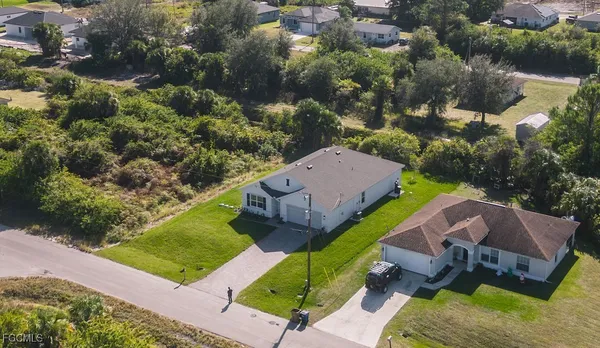 an aerial view of a house with a garden
