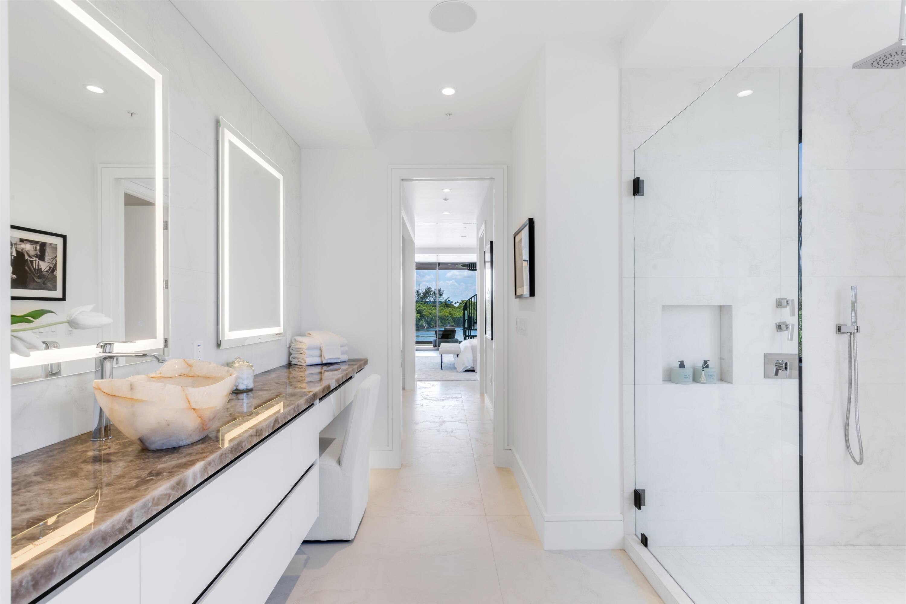 900 Lago Mar Lane, Unit PH Boca Raton, FL 33431 - Photo 24 of 58 a kitchen with stainless steel appliances granite countertop a refrigerator and a sink