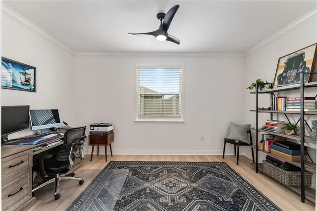 a workspace with furniture and wooden floor