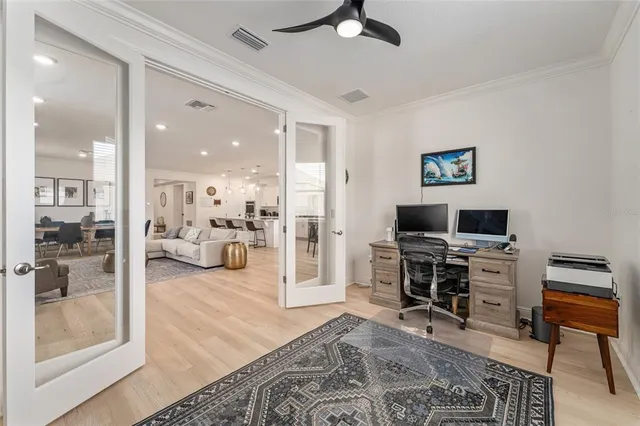 a view of a livingroom with furniture and a flat screen tv