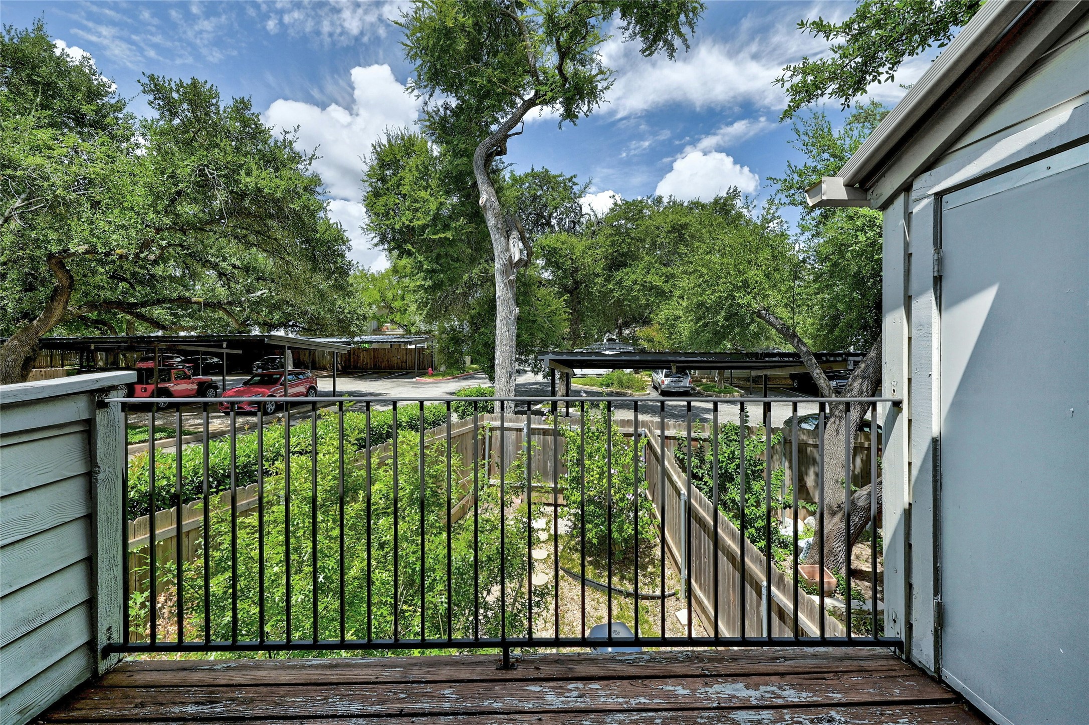 9226 Jollyville Road, Unit 221 Austin, TX 78759 - Photo 11 of 20 A private balcony overlooks lush greenery and convenient covered parking.