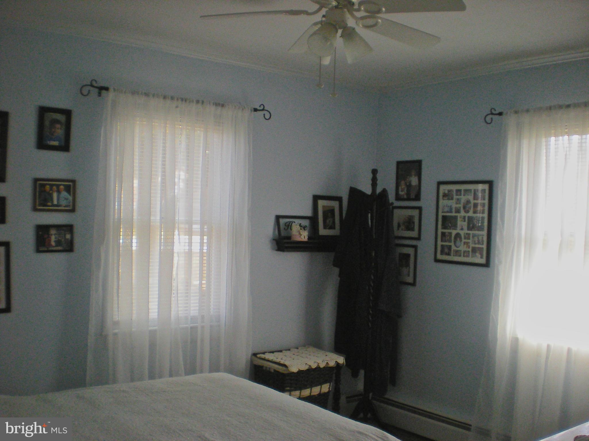 704 Kingfisher Road Deale, MD 20751 - Photo 14 of 27 a bedroom with a bed and a window