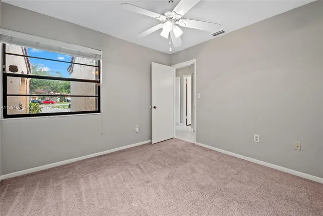 a view of a room with a fan