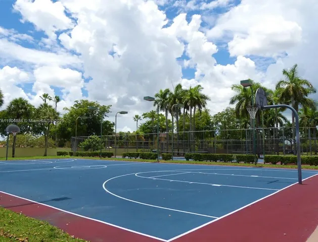 a view of a swimming pool with a deck and a garden