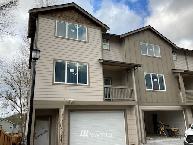 345 South 48th Court, Unit 9 Renton, WA 98055 - Photo 1 of 26 a front view of a house with balcony