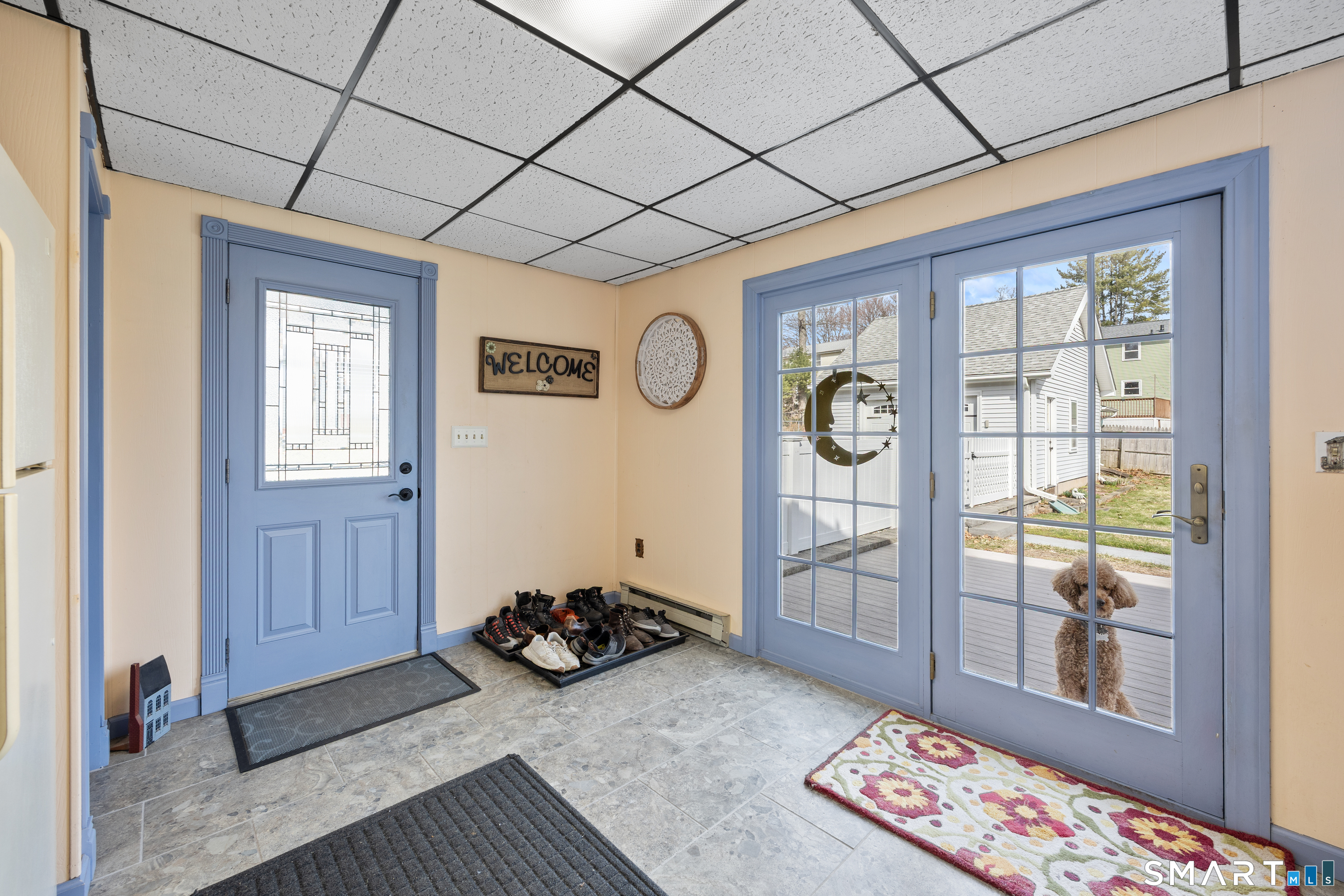141 Little Fawn Road Southington, CT 06489 - Photo 5 of 35 Huge Mud room from driveway and then out to the fenced in back yard.