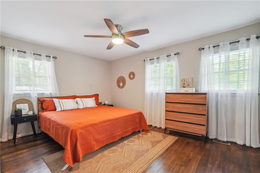 3483 Glensford Drive Decatur, GA 30032 - Photo 15 of 24 a bedroom with a bed and a chandelier