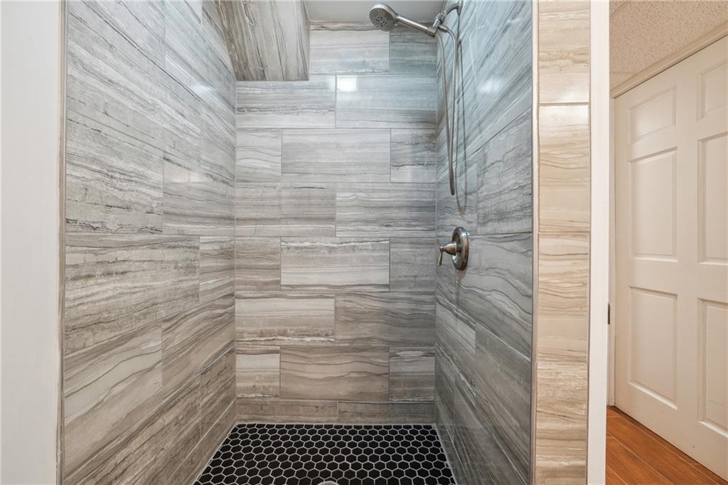 3483 Glensford Drive Decatur, GA 30032 - Photo 20 of 24 a bathroom with a shower