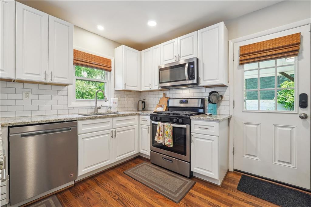 3483 Glensford Drive Decatur, GA 30032 - Photo 7 of 24 a kitchen with white cabinets appliances and a window