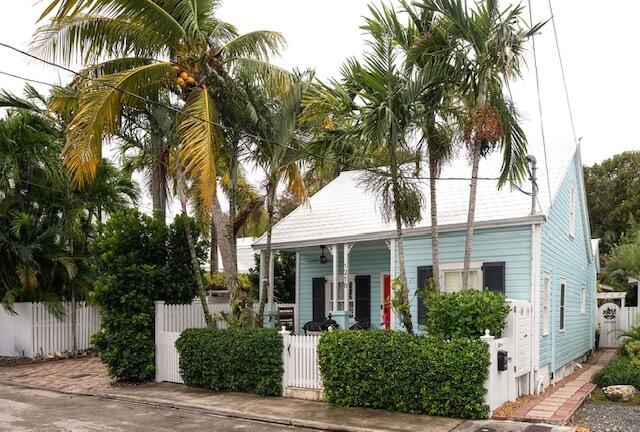 1218 Packer Street, Unit REAR Key West, FL 33040 - Photo 2 of 22 a front view of a house with a tree