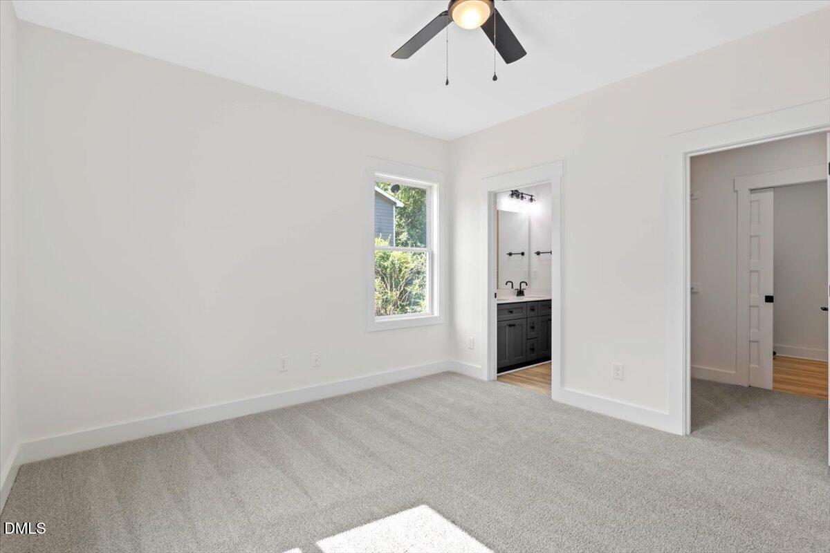 79 Theresia Lane Roxboro, NC 27574 - Photo 19 of 31 an empty room with windows and painted walls