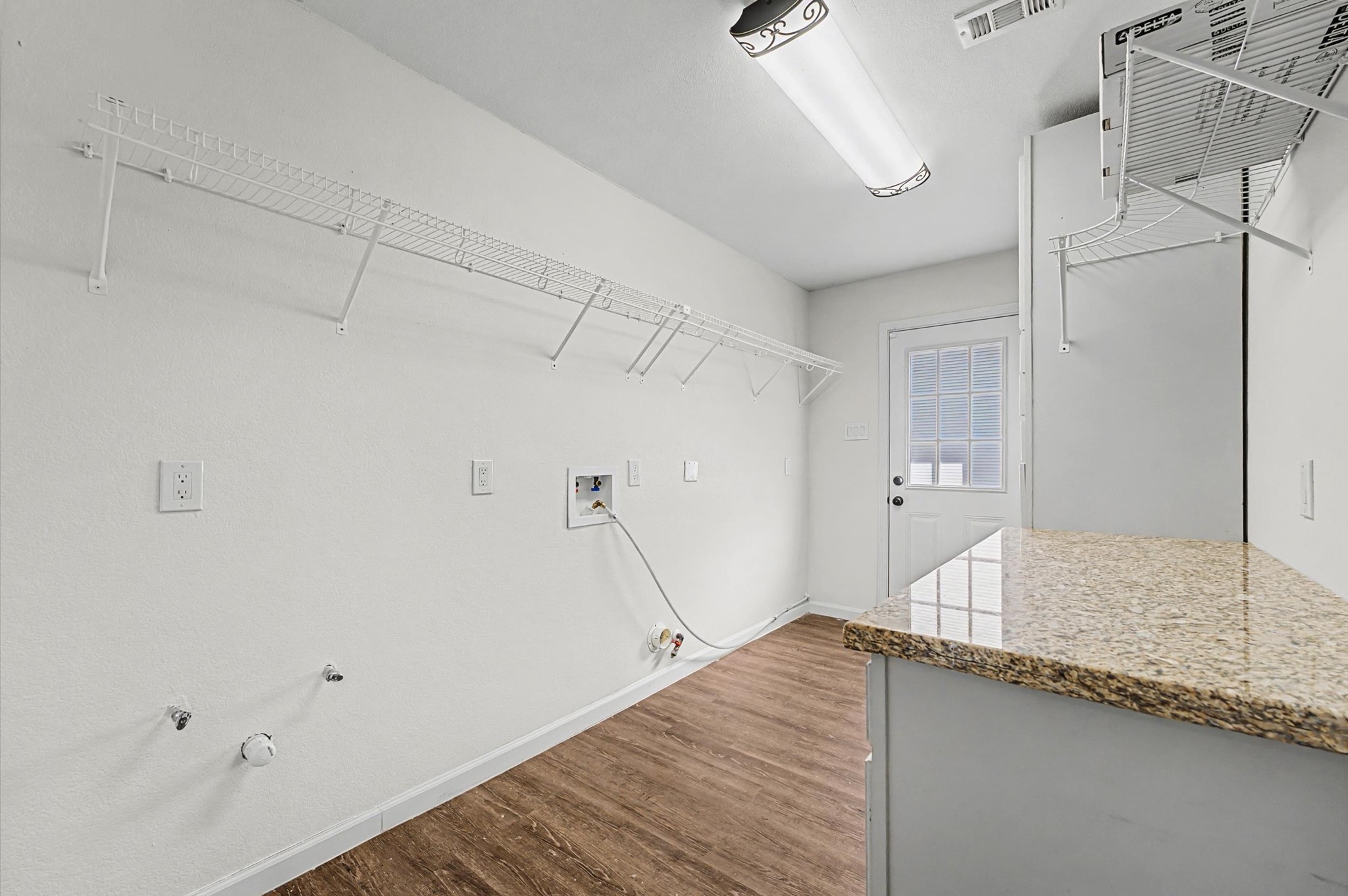 3812 Hardin Road Baytown, TX 77521 - Photo 19 of 30 Utility room, has extra storage plus a folding area