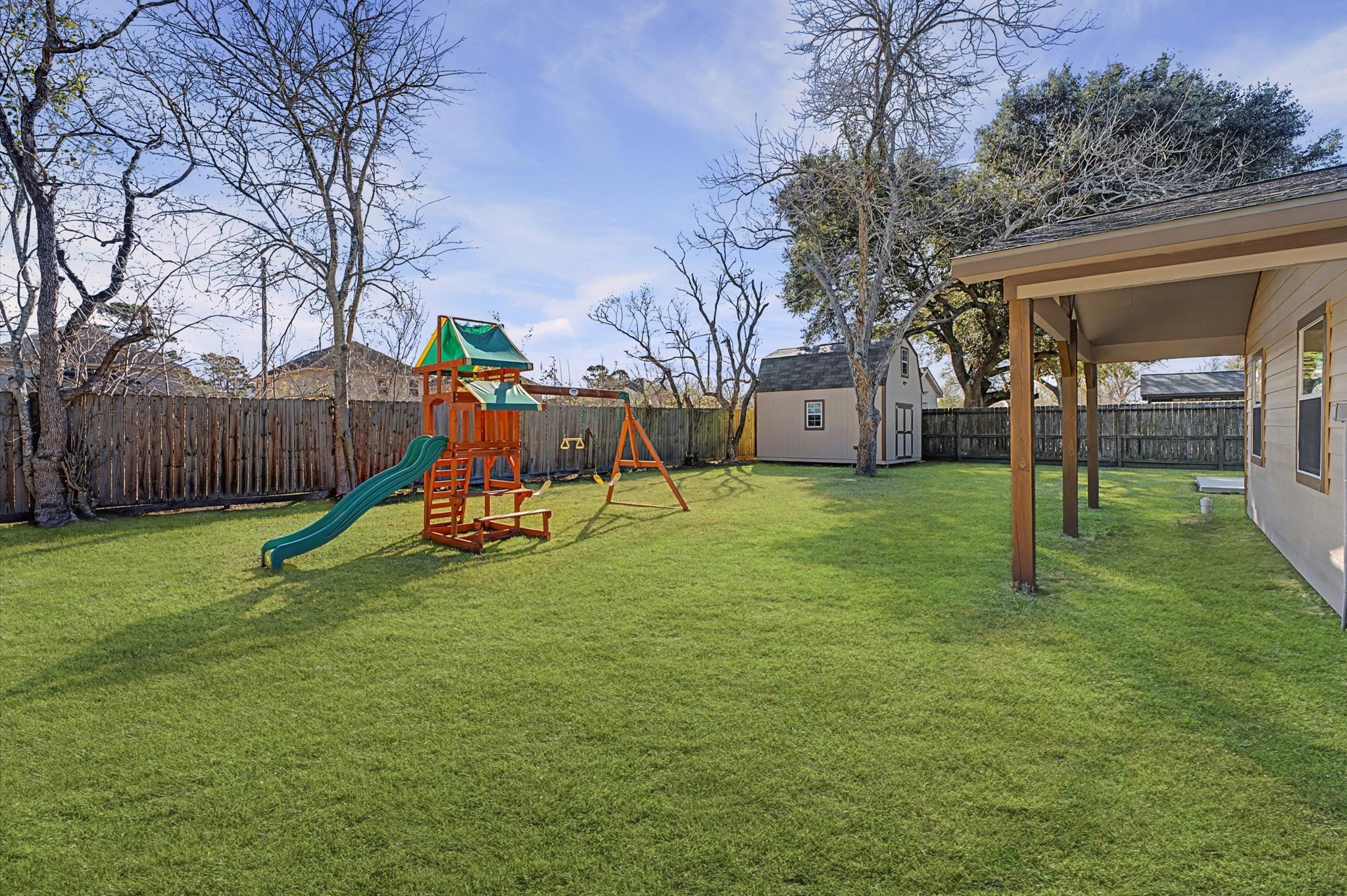 3812 Hardin Road Baytown, TX 77521 - Photo 21 of 30 Spacious yard with ample room for play and outdoor enjoyment, thoughtfully enhanced grass to highlight its full potential.