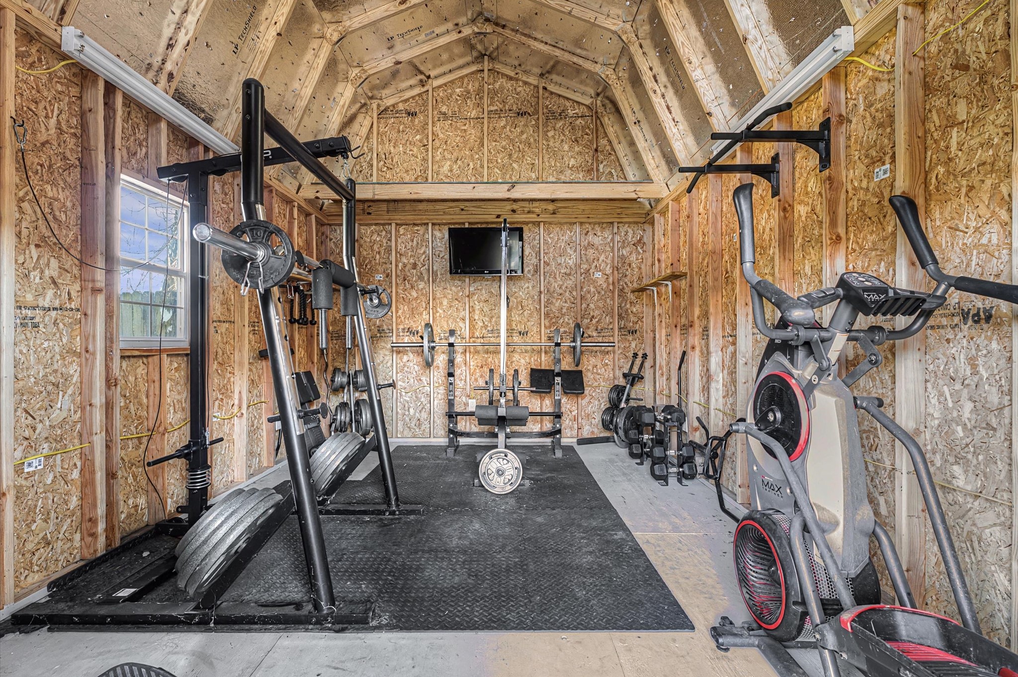 3812 Hardin Road Baytown, TX 77521 - Photo 23 of 30 The outdoor shop is currently being used as a gym and is equipped with electricity.