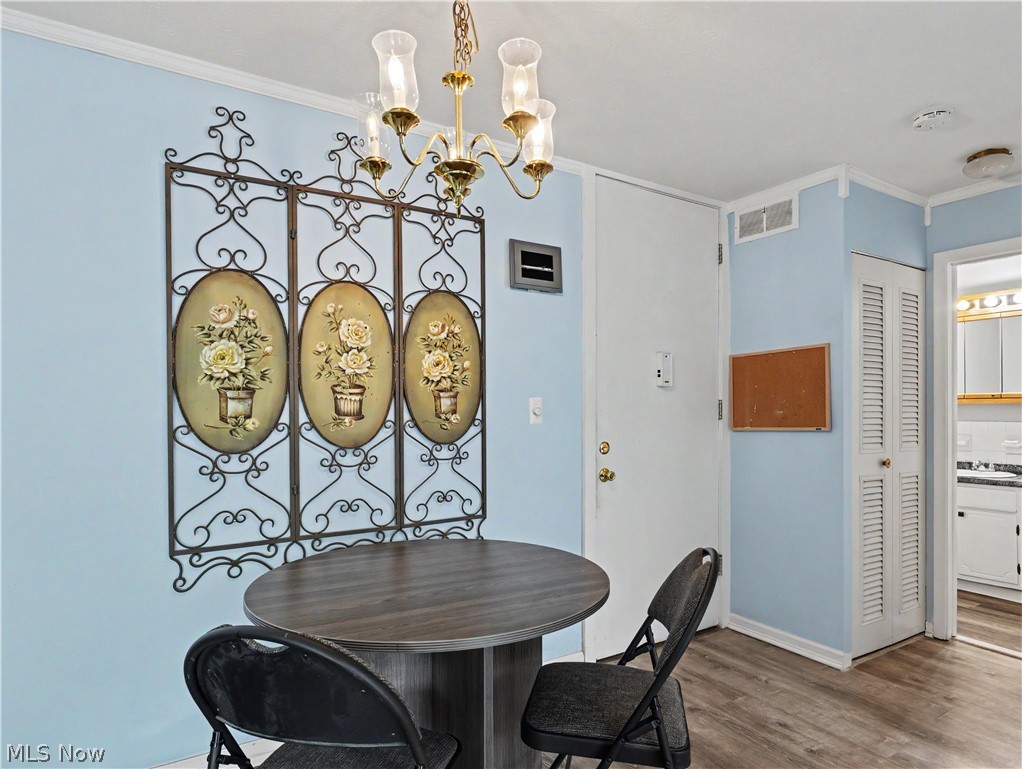 3064 Kent Road Stow, OH 44224 - Photo 8 of 30 Wood-finish flooring, light blue wall paint, and white trim
